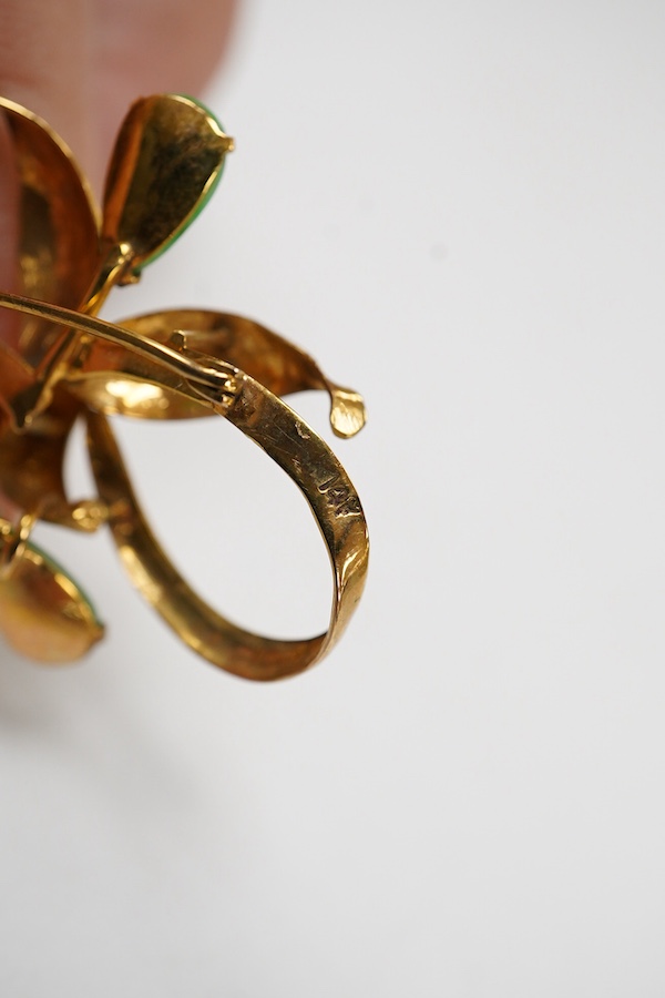 A 14k yellow metal and ten stone jade set foliate brooch, 58mm, gross weight 6 grams.